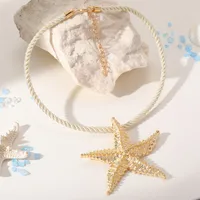 collier ras de cou étoile de mer doré